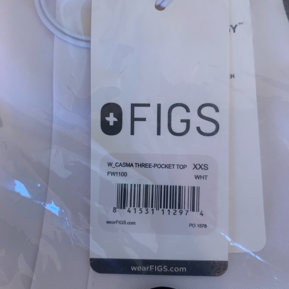 XXS Figs three-pocket top. White. New with tags.